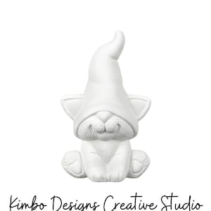 May include: White ceramic gnome figurine with a cat face and a pointed hat. The gnome is sitting with its legs crossed and has a small smile.