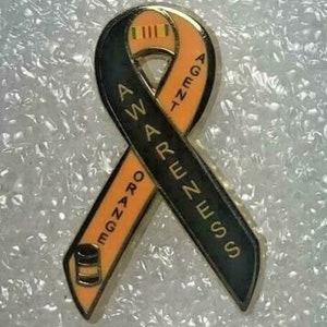 May include: Orange Awareness Ribbon with black background and the words "Orange Awareness" and "Agent Orange" written on it.