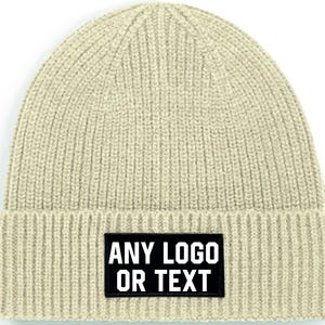 May include: A beige knitted beanie with a black patch that says "ANY LOGO OR TEXT".