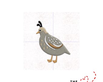 May include: An embroidered design of a quail, featuring a gray body with white and brown accents. The bird has a distinctive black crest and is set against a white background with grid lines. The text "THE EMBROIDERY DESIGN SPOT" is at the bottom.