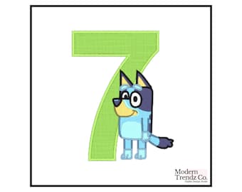 May include: An embroidered design featuring the number 7 in green, with a cartoon dog character in blue, black, and yellow. The dog is wearing glasses. The design is on a white background.