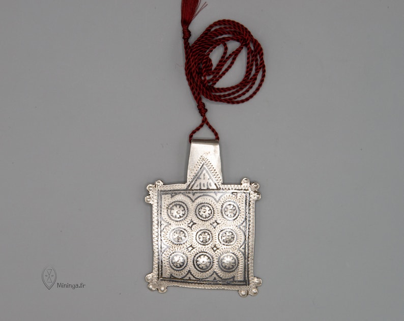 Antique silver pendant from Morocco with a minimalist silk rope