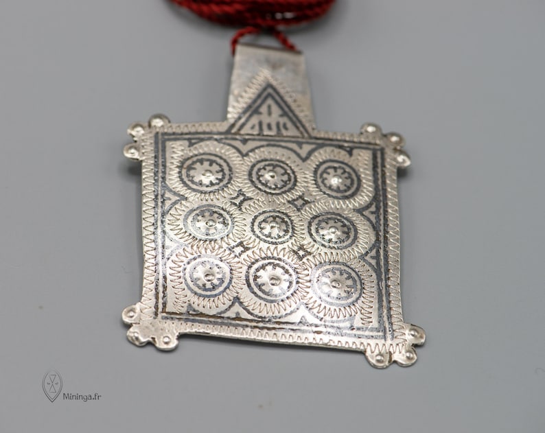 Antique silver pendant from Morocco with a minimalist silk rope