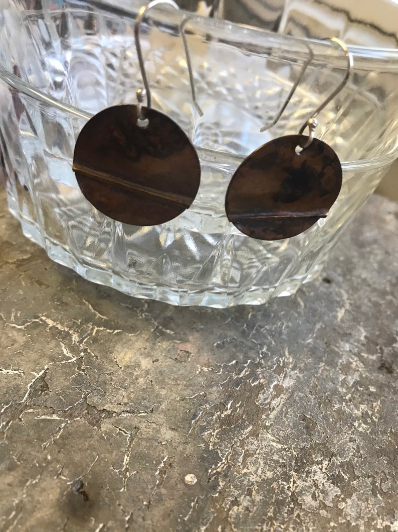 Dark brown copper textured copper earrings.