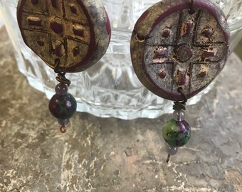 Funky “from the attic” polymer clay earrings. Patterned using buttons, painted distressed and sealed. Ruby zoisite and amethyst beads.