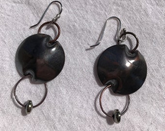 Handmade oxidized copper earrings with an additional drop of a bead in orbit.
