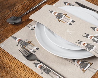 May include: A festive table setting featuring white plates, silverware, and beige placemats. The placemats and napkin have a repeating pattern of a cartoon character in a winter outfit. A spoon, fork, and knife are visible.
