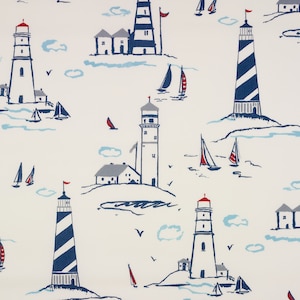 May include: A white background with a repeating pattern of blue and red lighthouses, sailboats, and small houses. The lighthouses have white stripes and red roofs. The sailboats are white with blue sails. The houses are white with blue roofs.