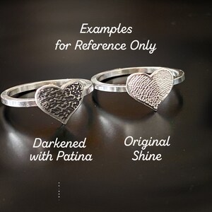 sterling silver fingerprint ring. Handmade Fingerprint is attached to the center square wire band. You can feel the deep engraving of the imprint. There are stacking bands on each side made from bead wire.
