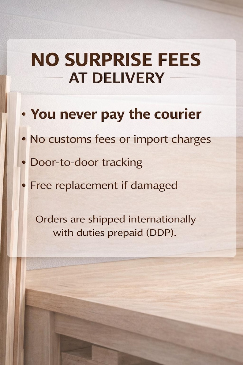 May include: A light-colored wooden surface with a white rectangular sign. The sign has the text "NO SURPRISE FEES AT DELIVERY" and bullet points detailing benefits like no courier payments, no customs fees, door-to-door tracking, and free replacements.