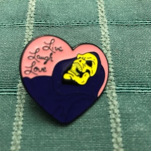 Skeletor Cartoon Pin. Live, Laugh, Love heart shaped pin. He-Man and the Master&#39;s of the Universe.