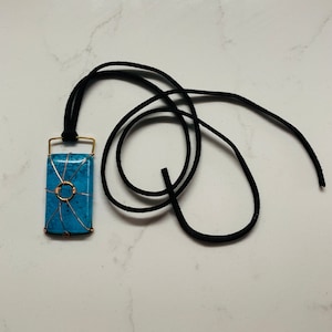 Wyatt&#39;s Moonstone necklace. Glow in the dark werewolf necklace.