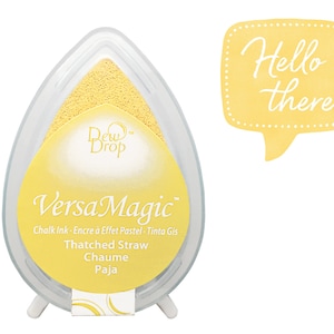 May include: Yellow VersaMagic chalk ink pad with the text "Thatched Straw, Chaume, Paja" and the Dew Drop logo. The ink pad is in a clear plastic container with a yellow sponge inside.