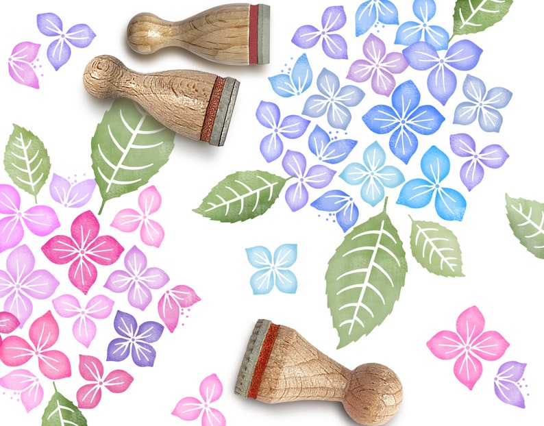 May include: Three wooden stamps with different designs of hydrangea flowers and leaves. The stamps are used to create a floral pattern on paper or fabric.