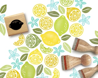 May include: A set of wooden stamps featuring lemons, limes, and leaves. The stamps are arranged in a semi-circle on a white background. The stamps are perfect for crafting and scrapbooking.