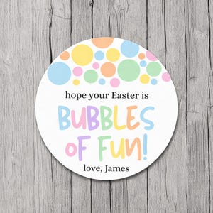 May include: A white, circular sticker with pastel-colored bubbles and the text "hope your Easter is BUBBLES OF FUN!" in colorful, playful lettering. The sticker includes the text "love, James".