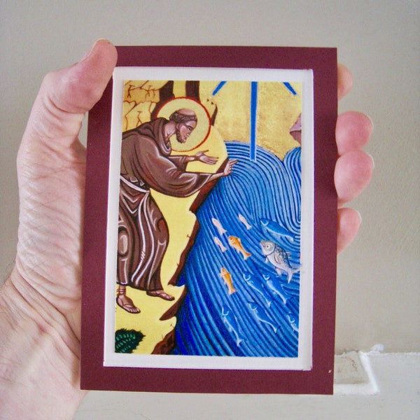 Small religious icon titled Saint Anthony preaching to the fish.  A digital art print with gold leaf sealed on card of a popular saint.