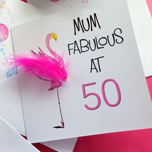 May include: Pink flamingo birthday card with a pink feather and the text "Mum Fabulous at 50".