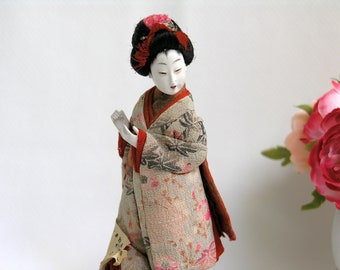 porcelain geisha doll