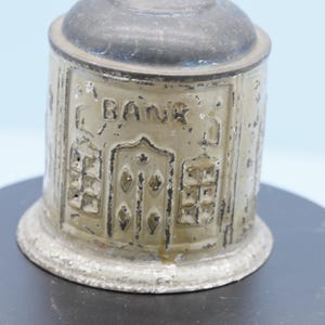 Antique round building tin bank
