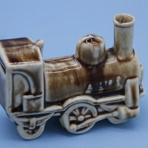 Vintage Ceramic small train engine coin bank