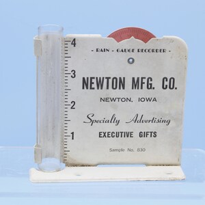 VINTAGE NEWTON mfg. com salesman sample no. 830 metal advertising rain