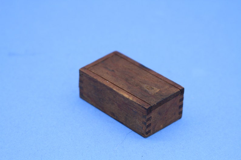 Vintage miniature wooden dovetail box with sliding lid and sewing needles
