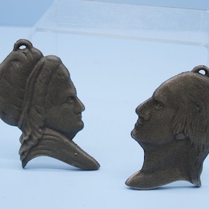 Vintage cast metal George Martha Washington silhouette wall hangings