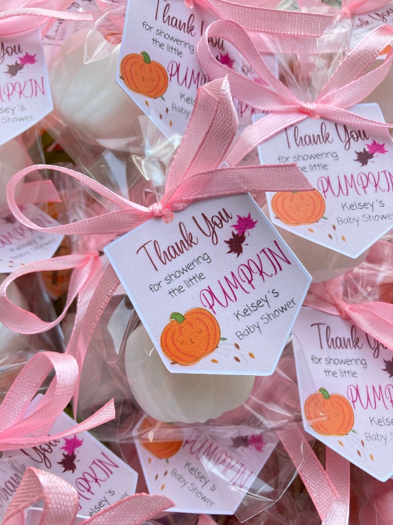 May include: Pink and white favor bags with a white pumpkin-shaped soap and a thank you tag that says "Thank You for showering the little PUMPKIN Kelsey's Baby Shower".