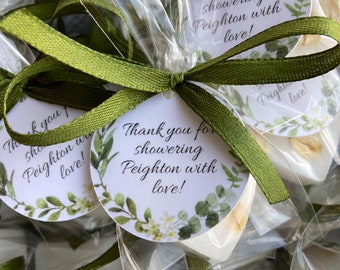 May include: Green and white favor bags with a white tag that says "Thank you for showering Peighton with love!"  The bags are tied with a green ribbon.