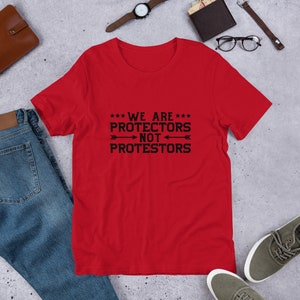 We are Protectors Not Protesters T-Shirt – Stand for What Matters
