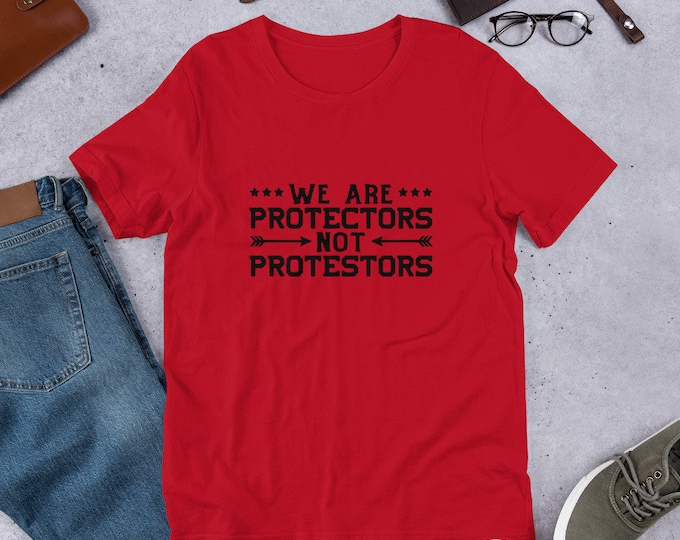 We are Protectors Not Protestors Short-Sleeve Unisex T-Shirt