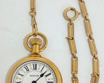 Reloj de bolsillo WestClox Conductor, tono dorado con cadena