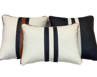 A collection of leather twin striped cushions
