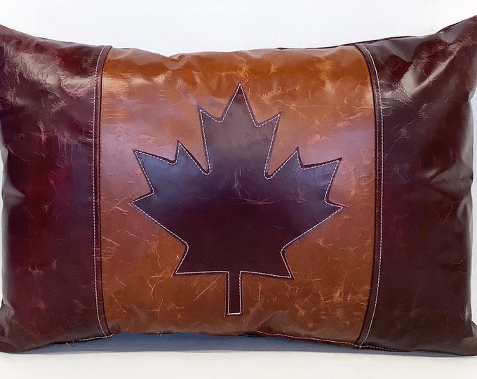 The cracked Leather Canada flag cushion