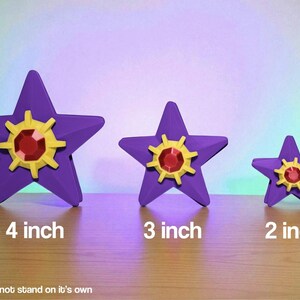 Starmie pokemon fidget spinners on a table