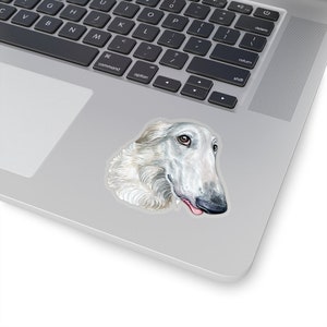 May include: A white Borzoi dog with a long snout and floppy ears. The dog is looking to the right and has its tongue sticking out.