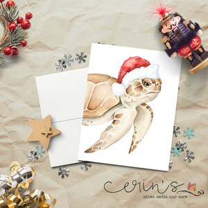 May include: A watercolor illustration of a sea turtle wearing a red Santa hat. The turtle is facing the right side of the image. The background is white.