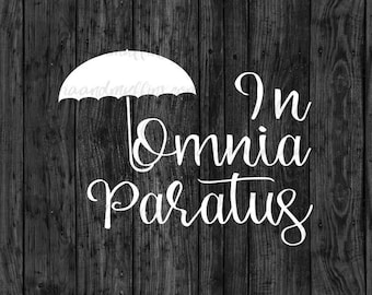 May include: A white graphic decal featuring a stylized umbrella icon positioned above the text In Omnia Paratus, written in a flowing cursive script. The design is presented against a dark, vertical wood grain texture background.