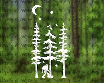 May include: A white vinyl decal featuring a silhouette of three pine trees, a crescent moon, several small stars, and a Bigfoot figure standing at the base of the trees. The design is centered and displays a clear, crisp graphic illustration.