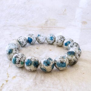 K2 Blue 12mm Round Stretch Stacking Bracelet - Rare Gemstone