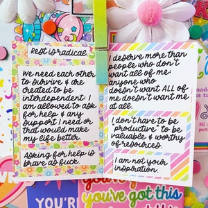 May include: Two colorful affirmation cards with inspirational messages. The first card says "Rest is radical. We need each other to survive & are created to be interdependent: I am allowed to ask for help & any support I need or that would make my life better. Asking for help is brave as fuck." The second card says "I deserve more than people who don't want all of me: anyone who doesn't want ALL of me doesn't want me at all. I don't have to be "productive" to be valuable & worthy of resources. I am not your inspiration."