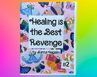 May include: A small, square book with a pink background covered in butterfly illustrations. The cover features the text "Healing is the Best Revenge" by Karina Hagelin, with a small "#2" in the corner.