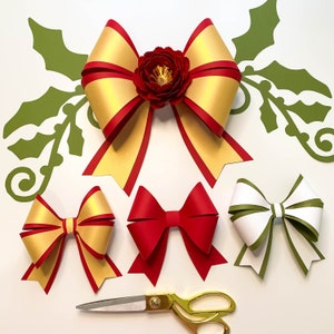 May include: Three paper bows in different colors and styles. A gold and red bow with a red flower in the center, a red bow, and a white and green bow.