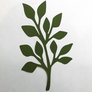 May include: A dark green paper silhouette of a leafy branch with multiple leaves.