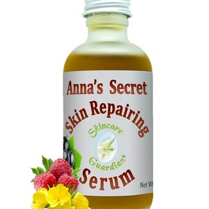 May include: A glass bottle of Anna's Secret Skin Repairing Serum with a silver lid. The bottle is filled with a yellow liquid. The label is white with red text that says "Anna's Secret Skin Repairing Serum". The label also has a small image of a flower and the text "Skincare Guardian".