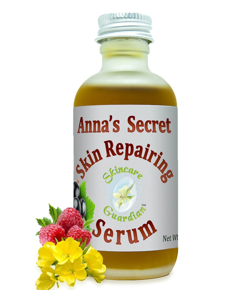 May include: A glass bottle of Anna's Secret Skin Repairing Serum with a silver lid. The bottle is filled with a yellow liquid. The label is white with red text that says "Anna's Secret Skin Repairing Serum". The label also has a small image of a flower and the text "Skincare Guardian".