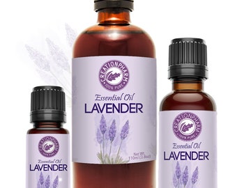May include: Three amber glass bottles of lavender essential oil with black caps. The bottles are labeled "Creation Pharm 100% Pure Essential Oil Lavender" and have a lavender flower illustration. The bottles are 15 ml, 30 ml, and 110 ml.