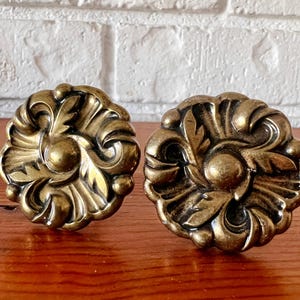 May include: A rustic wooden sign with the text "Welcome to our home" in white lettering. The sign has a distressed finish and a simple, inviting design, ideal for entryway decor.