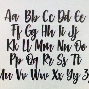 May include: Black cursive alphabet letters A to Z, displayed on a white background. The letters are in uppercase and lowercase, with a handwritten style. The image is a close-up of the alphabet.